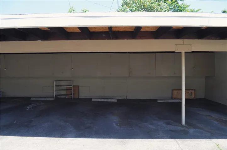 One carport space with overhead storage