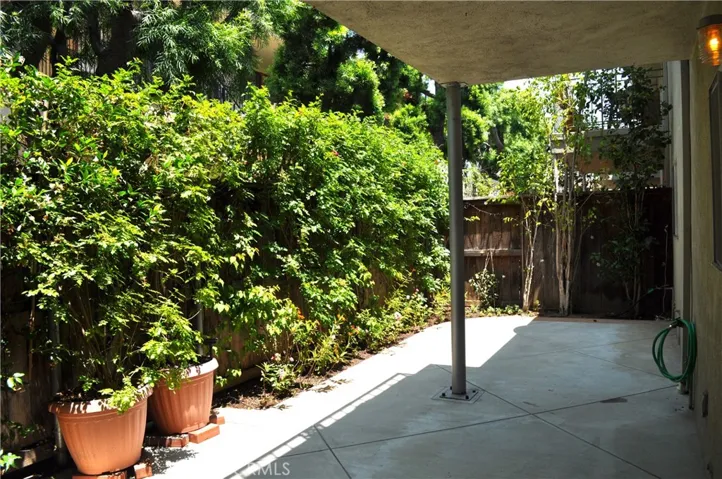 Step outside onto the patio! Beautiful plants and trees