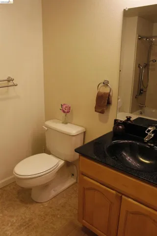 Full bath featuring vanity and shower / washtub combination