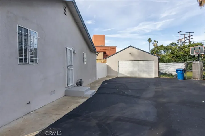 freshly laid asphalt & the 2 car garage