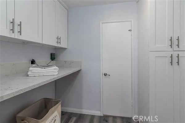 Laundry room next to kitchen