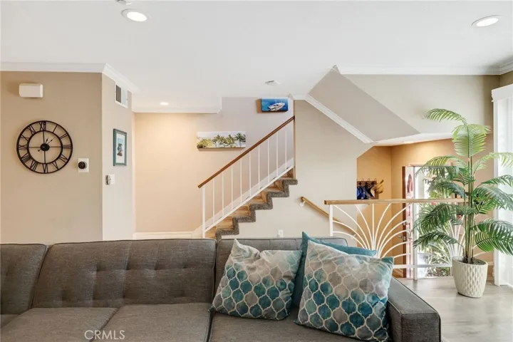 living room leads to upstairs bedrooms