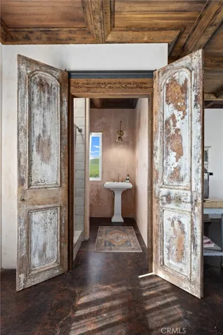 Antique doors leading to the bathroom