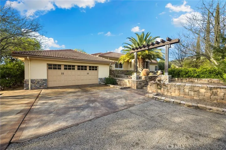 Spacious garage for two cars and ample of parking in front of the house