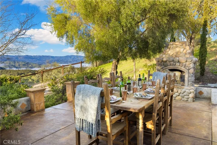 A mediterranean vibe sitting with outdoor fireplace