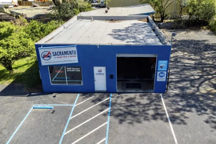 Exterior space featuring a pad mount transformer and a rolled roof