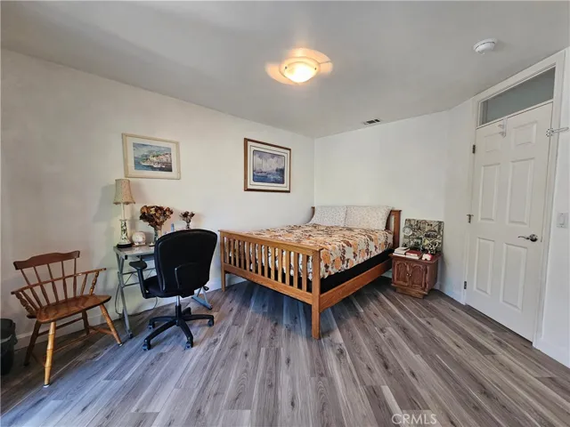 Spacious 2nd bedroom located on 1st floor with access to patio garden w/mirrored closet doors.