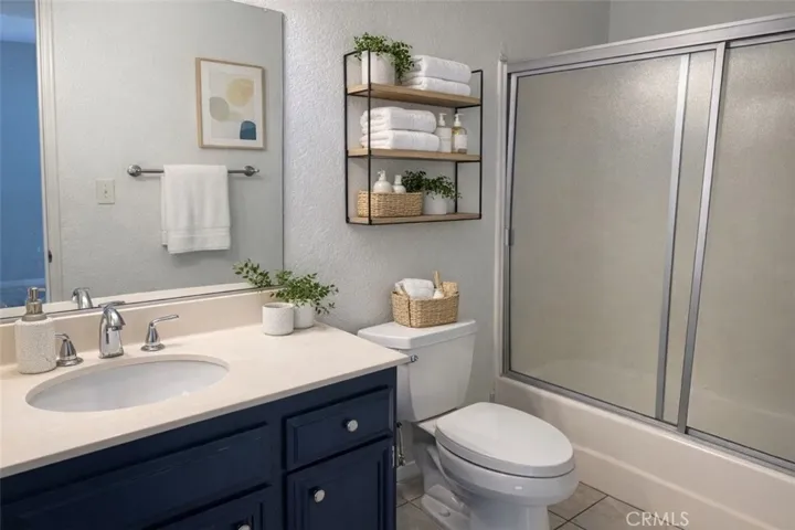 Upper level jack and jill bath.  Virtual staging.