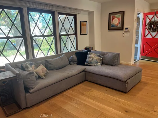 Living room with charming windows.