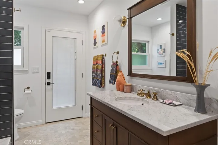 Full downstairs full bath - Remodeled, and goes out to the pool!