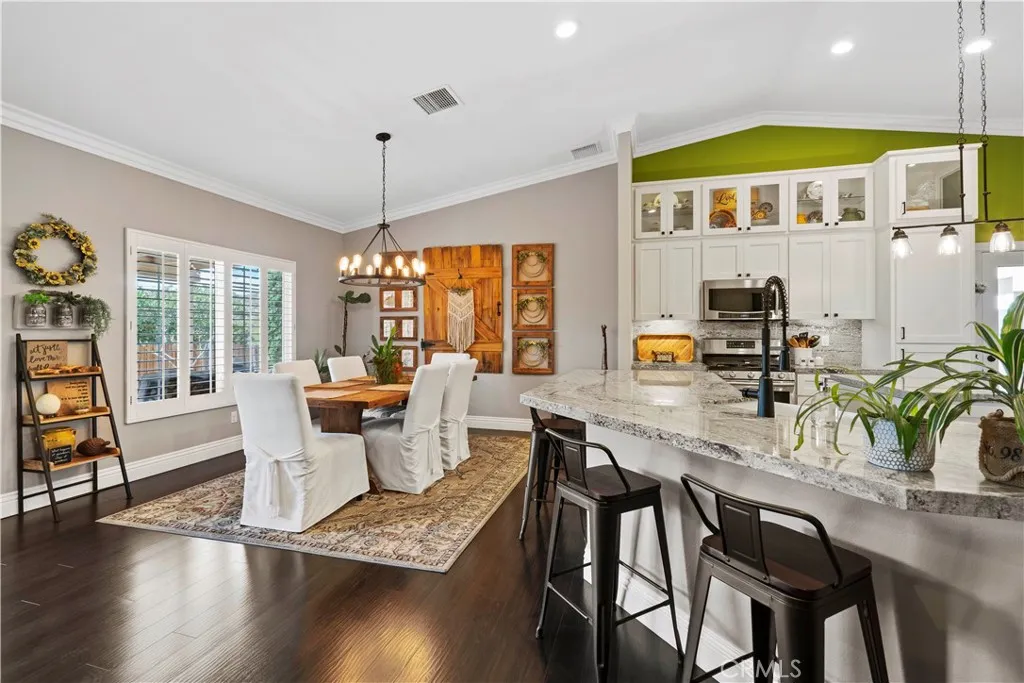 Granite counters and lots of space for entertaining. Plantation shutters
