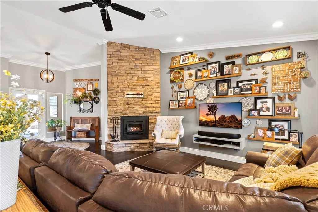 Living room with Custom air-tight wood stove with fan.