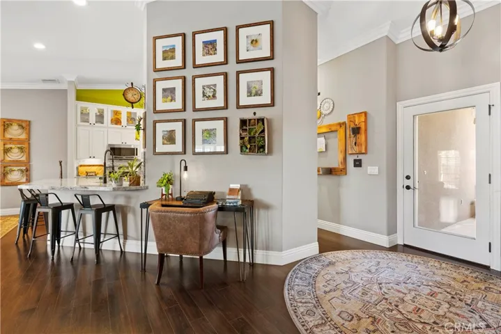 There is a nice sized walk-in pantry behind that wall. Pantry has shelving, customized organization and drawers.
Crown molding and baseboards.