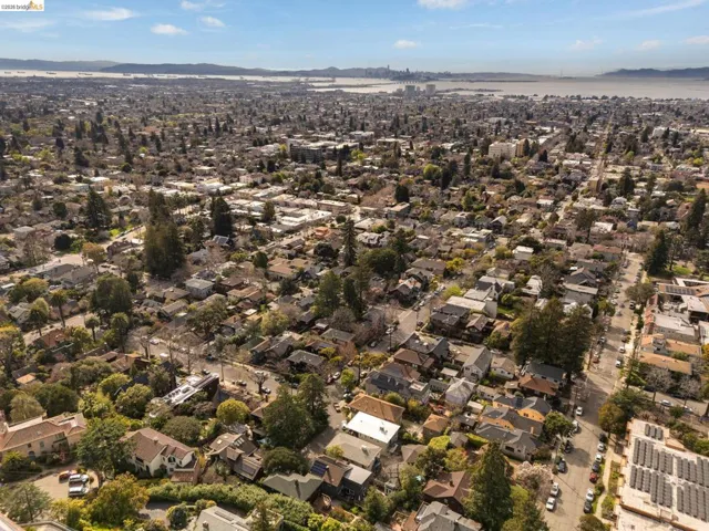 Aerial perspective of suburban area featuring a mountain backdrop