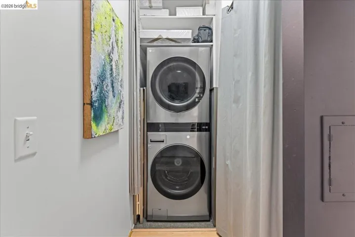 Washroom featuring estacked washer and dryer
