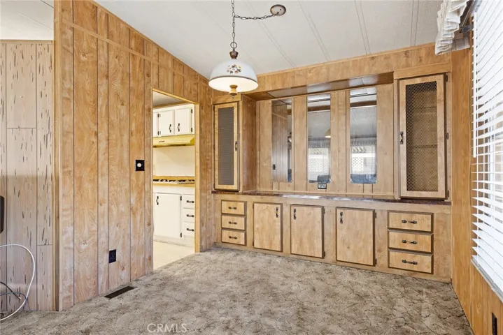 Dining room with built in hutch and door to kitchen