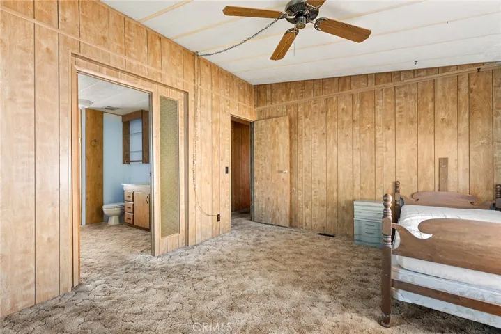 Primary bedroom and door to primary bathroom