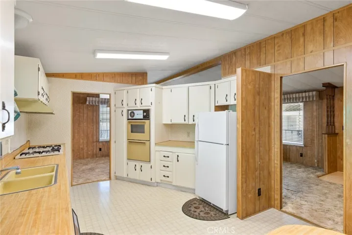 Kitchen with doors to the living room and dining room