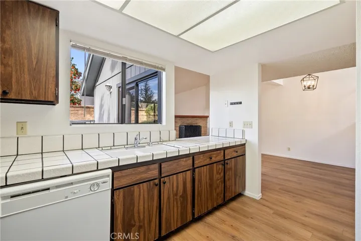 There is a pass-through window to the living room that helps open up the kitchen and would be a nice spot to pull up a barstool.