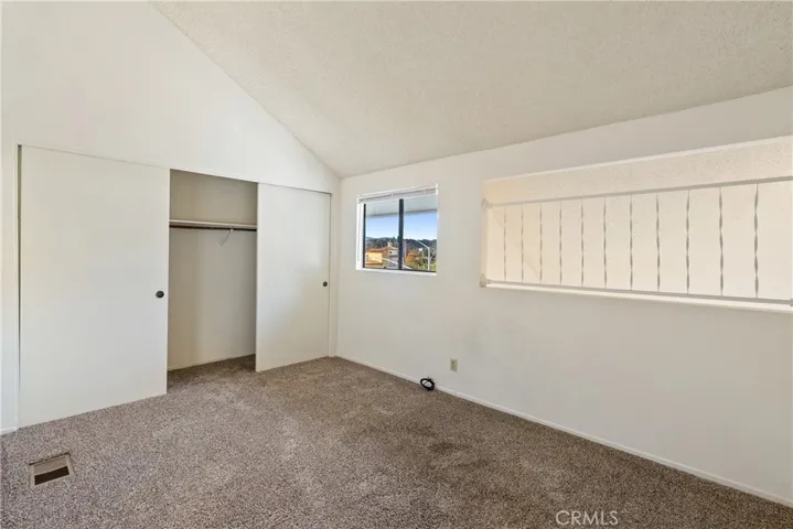 Bedroom 2 also has a large closet and vaulted ceilings.