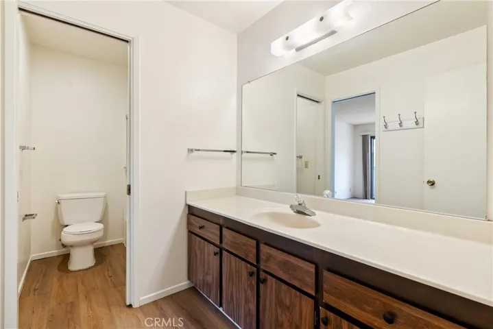 The main bathroom offers a sizable vanity and separate shower area.