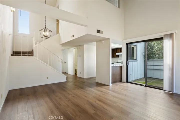 Laminate wood floors run throughout the bottom level.