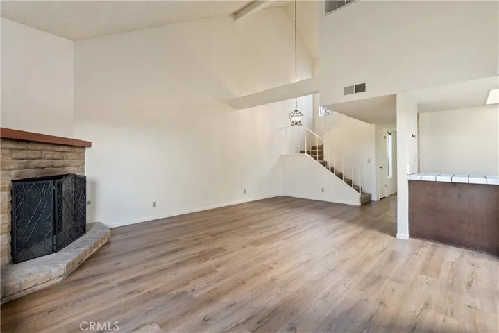 The living room is a comfortable space to relax or entertain guests. There is a cozy gas fireplace in the corner to help set a calming mood.