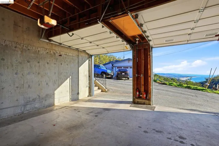 Garage featuring a garage door opener