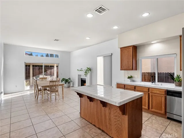 Expansive open-concept design connecting kitchen, dining, and family areas.