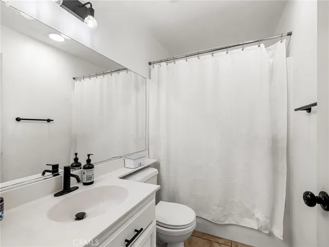 The home also offers a well-positioned hall bathroom with a shower/tub combo and natural light — perfect for guests or family members.