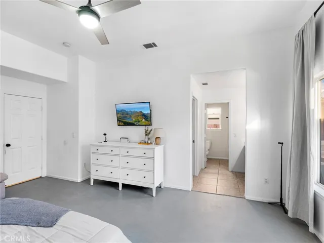 En-suite bathroom with dual sinks, generous vanity space, and a functional layout designed for convenience. Includes a shower/tub combination and ample storage.
