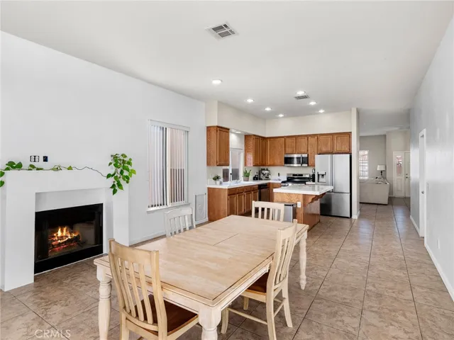 Open-concept connects kitchen, dining, and family areas.