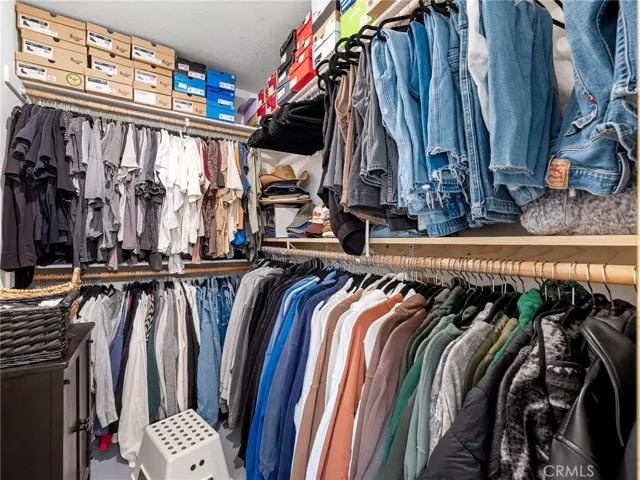 Roomy walk-in closet providing excellent storage and organization space.
