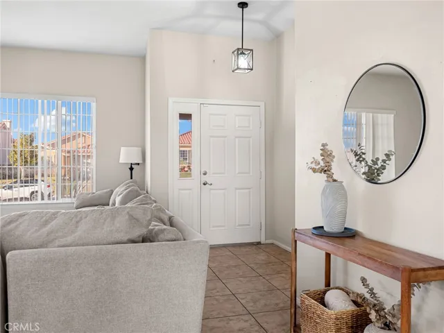 Spacious living area with abundant natural light and neutral tones throughout.