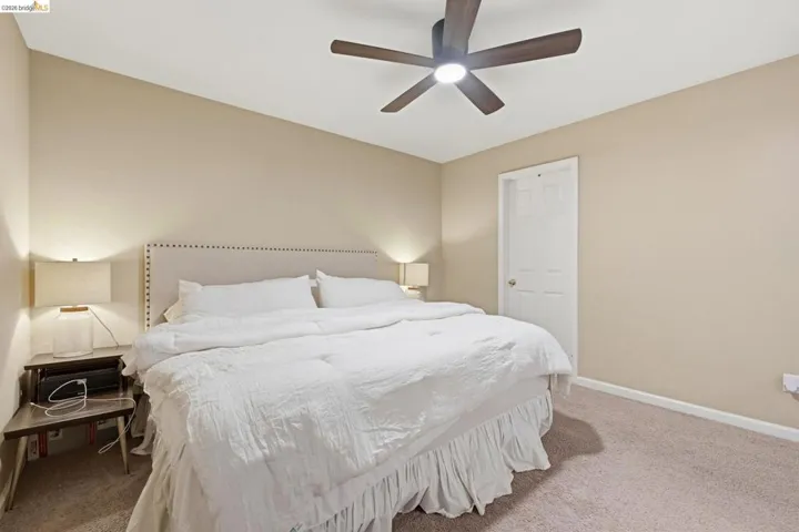 Bedroom featuring carpet floors and a ceiling fan