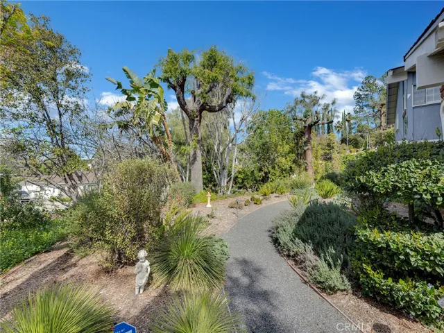 Meandering paths that go around the entire property offering privacy and seclusion