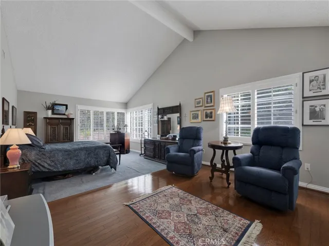 Large primary bedrooms with vaulted ceilings and natural light