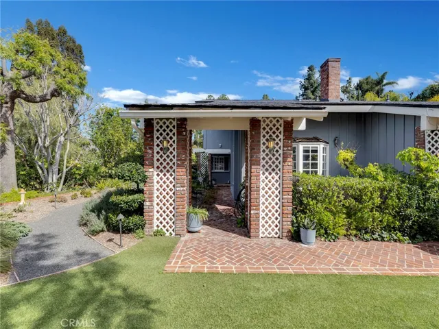 Brick entrance to front door.  Private and landscaped