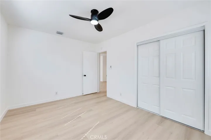 Another view of primary bedroom