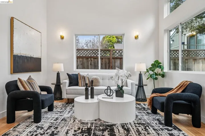 Living area with wood finished floors and healthy amount of natural light