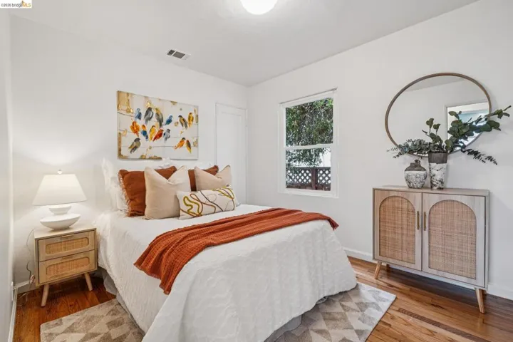 Bedroom with hardwood / wood-style floors