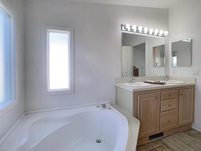 This Primary Bathroom offers a wonderful soaking tub and stall shower.