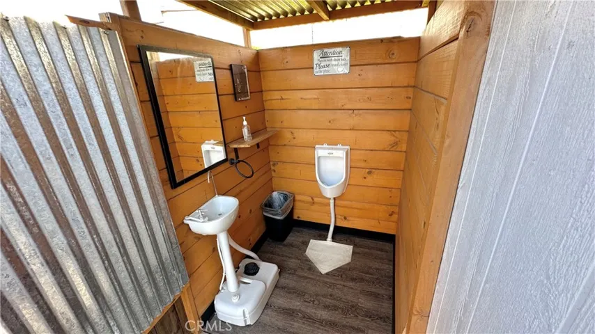 interior of the outhouse that is connected to septic