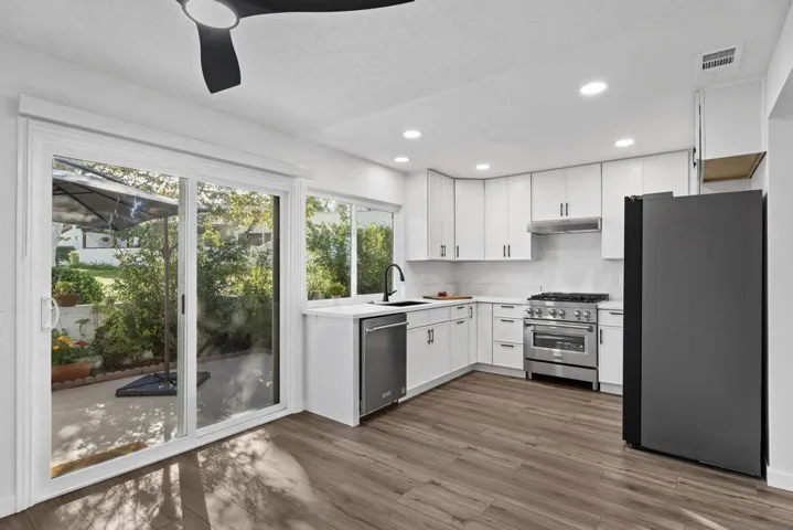 New window and slider provide fresh views to your sunny patio and the greenbelt beyond.