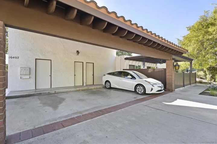 Carport, area.  Center spot is assigned to unit 155