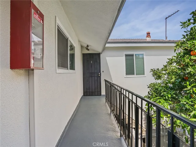 Back of building, upstairs walkway to unit 4