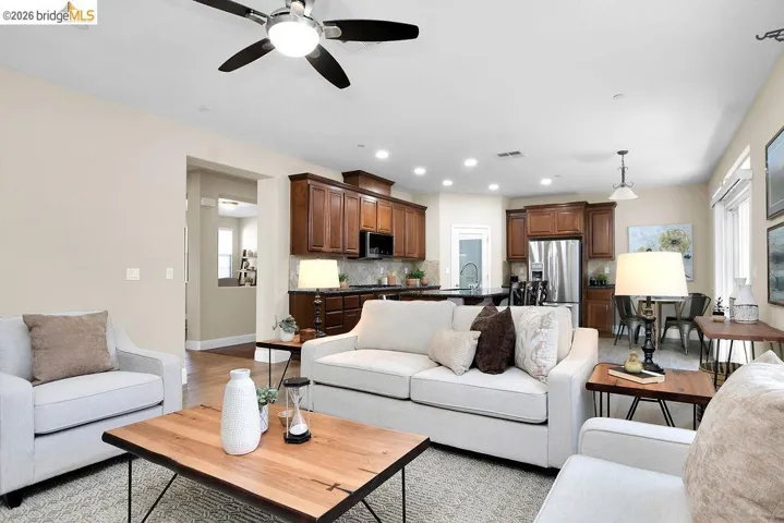 Living area with a ceiling fan and recessed lighting