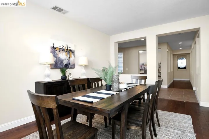 Dining room with dark wood finished floors