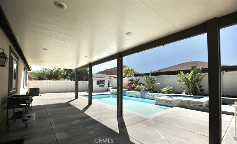 Fully insulated Alum-A-Wood patio cover with LED lights helps enjoy backyard featuring newer pool / spa and connections ready for outdoor kitchen