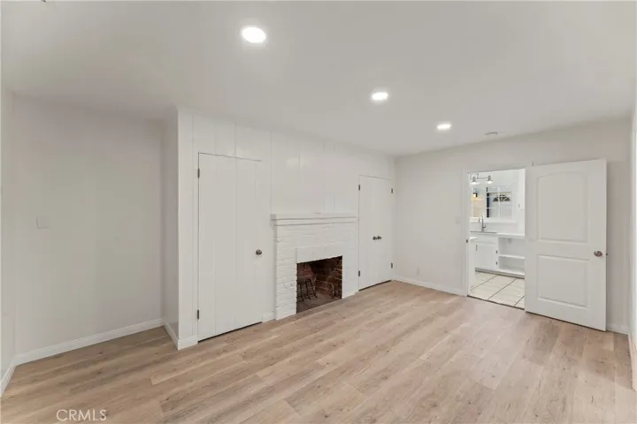 Primary bedroom w/ fireplace